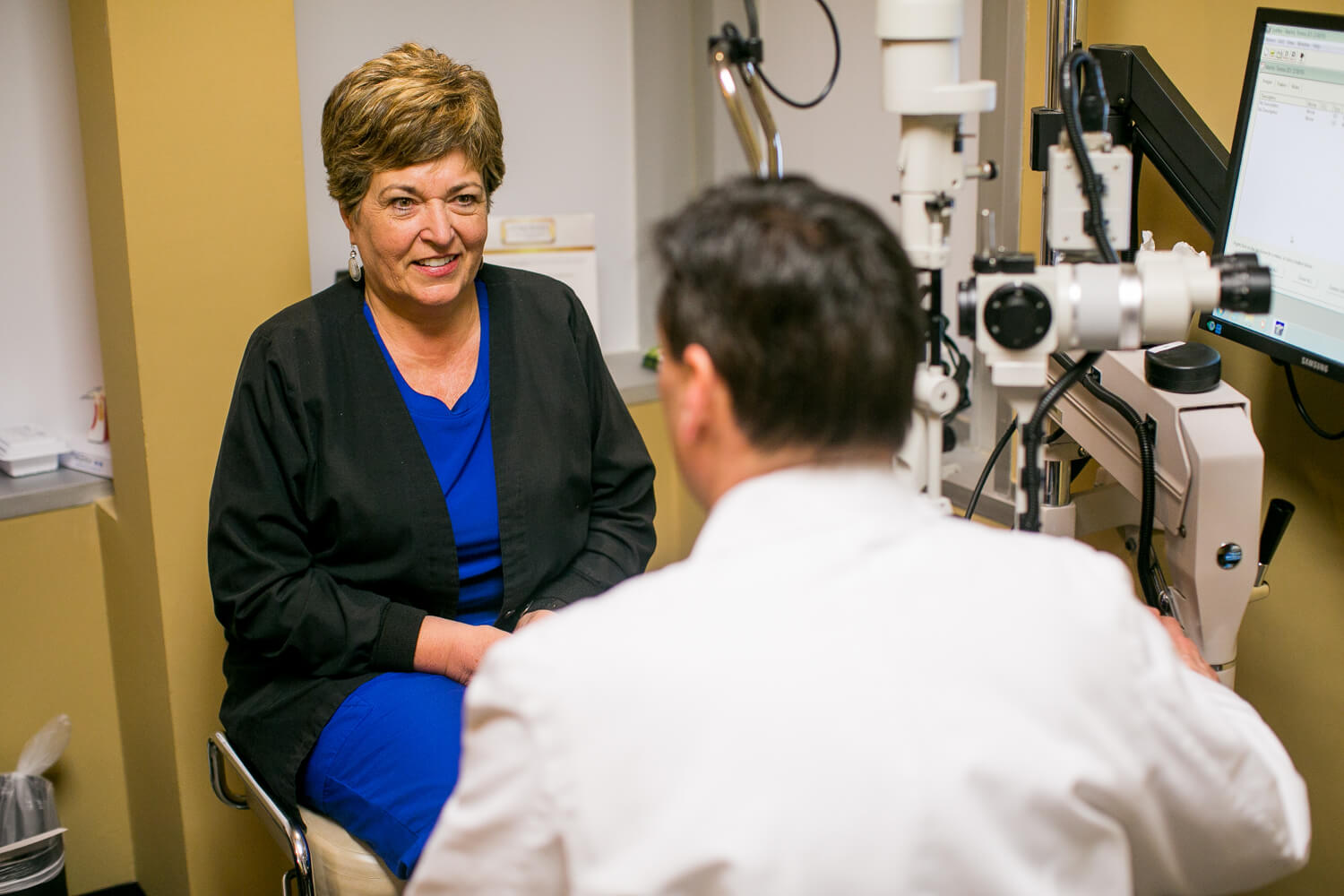 eye doctor and patient talk